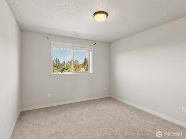 904 E Tanoak Ave, La Center, WA 98629 - carpeted empty room with a textured ceiling and baseboards
