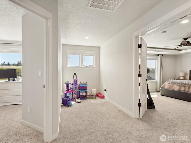 904 E Tanoak Ave, La Center, WA 98629 - playroom featuring carpet, a textured ceiling, a ceiling fan, and baseboards