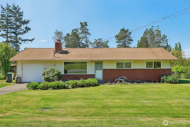 ranch-style house with a chimney, a front lawn, brick siding, and asphalt driveway