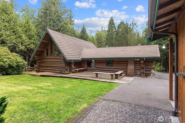 1321 E Smith Rd, Bellingham, WA 98226 - back of property with log siding and a lawn