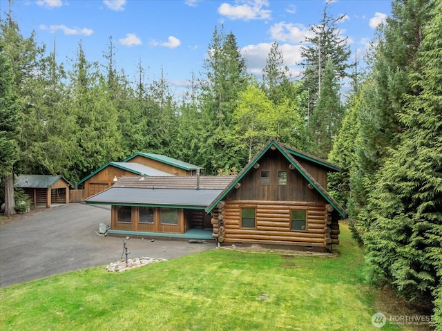 1321 E Smith Rd, Bellingham, WA 98226 - view of front facade with log exterior, a front lawn, and a view of trees