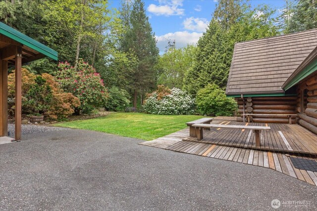 1321 E Smith Rd, Bellingham, WA 98226 - view of patio featuring a deck and view of scattered trees