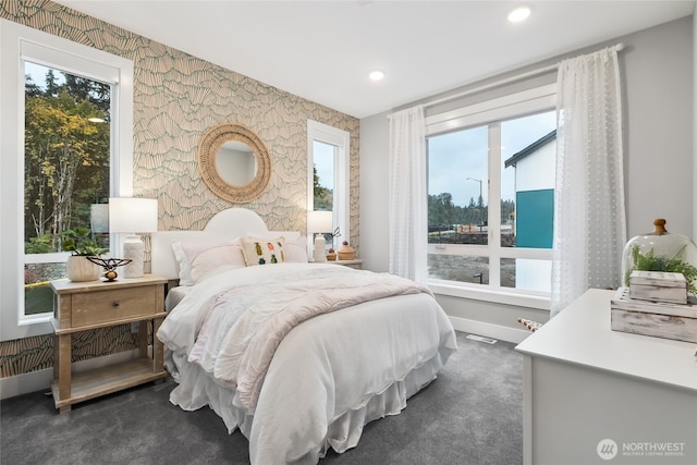 bedroom with visible vents, baseboards, wallpapered walls, dark colored carpet, and recessed lighting