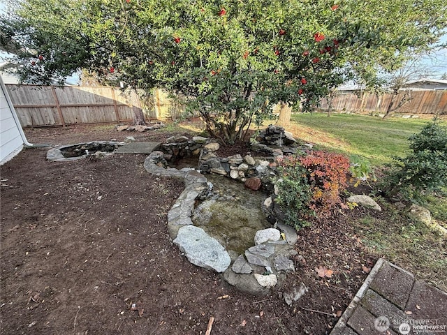 view of yard featuring a fenced backyard