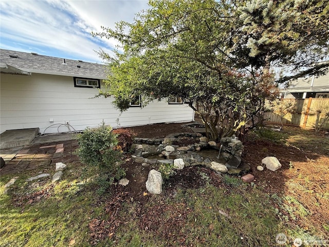 view of side of property with fence