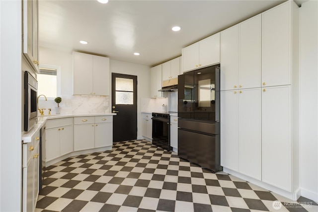 kitchen with light countertops, tile patterned floors, smart refrigerator, and wall oven