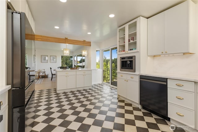kitchen featuring recessed lighting, light countertops, light floors, and dishwasher
