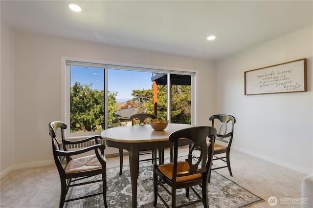 dining area featuring light colored carpet, recessed lighting, and baseboards