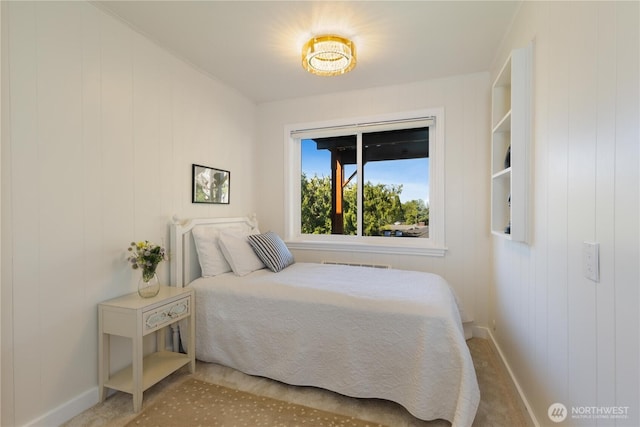 carpeted bedroom with baseboards