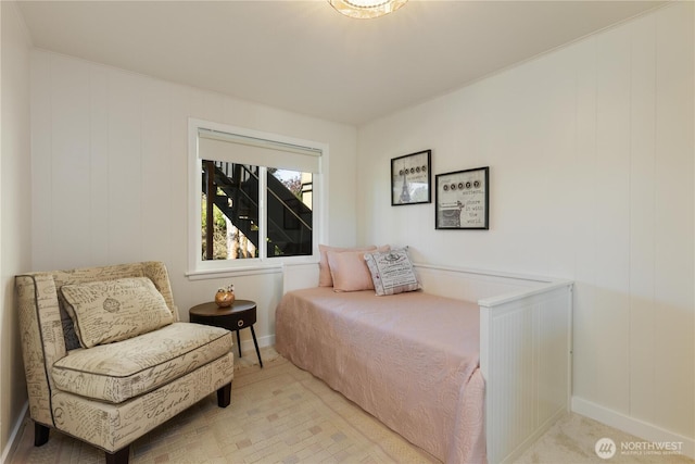 bedroom with baseboards and carpet