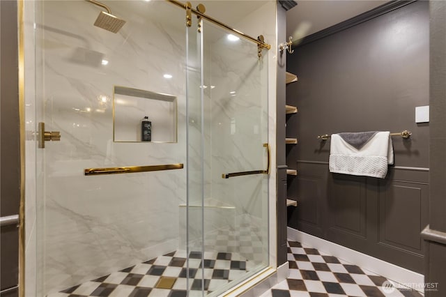bathroom featuring tile patterned floors, ornamental molding, and a marble finish shower