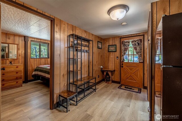 2684 Cedar Crst, Leavenworth, WA 98826 - foyer featuring light wood finished floors, healthy amount of natural light, and wood walls