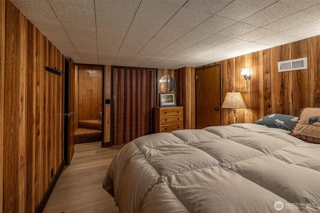 2684 Cedar Crst, Leavenworth, WA 98826 - bedroom with wooden walls and wood finished floors