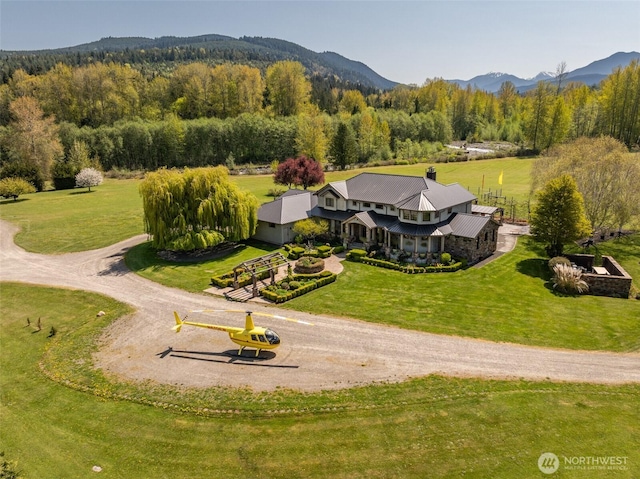 bird's eye view with a wooded view and a mountain view