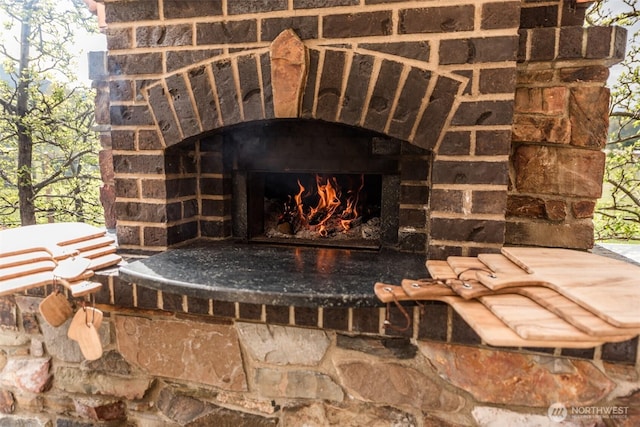 exterior details with a lit fireplace