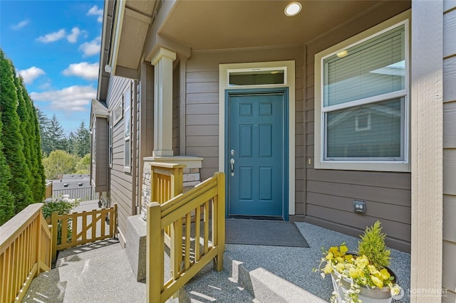 entrance to property featuring a porch