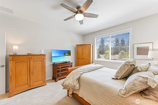 bedroom with a ceiling fan, light carpet, visible vents, and baseboards