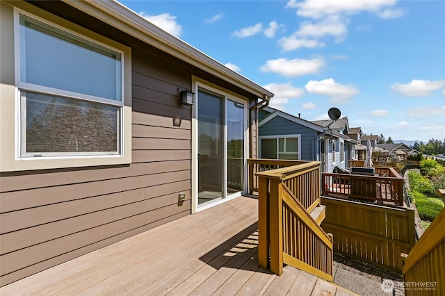 wooden deck with a residential view