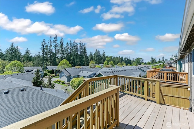 wooden terrace featuring a residential view