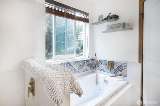 full bathroom featuring a whirlpool tub