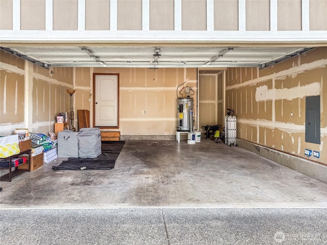 garage featuring water heater and electric panel