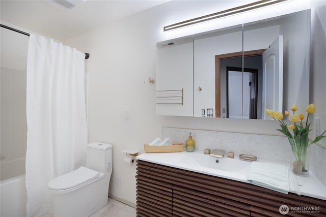 bathroom with toilet, vanity, and shower / bath combo with shower curtain