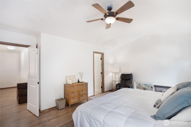 18150 75th Ave E, Puyallup, WA 98375 - bedroom featuring wood finished floors, vaulted ceiling, and ceiling fan