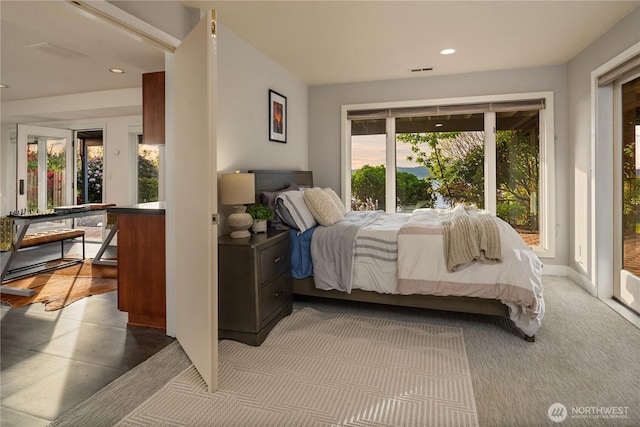 bedroom with recessed lighting, access to outside, and baseboards
