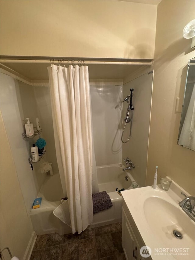 bathroom with vanity and shower / tub combo with curtain