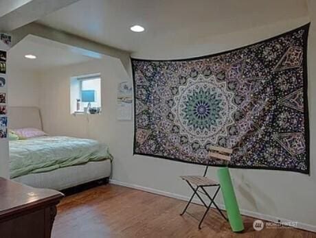 bedroom featuring recessed lighting, baseboards, and wood finished floors
