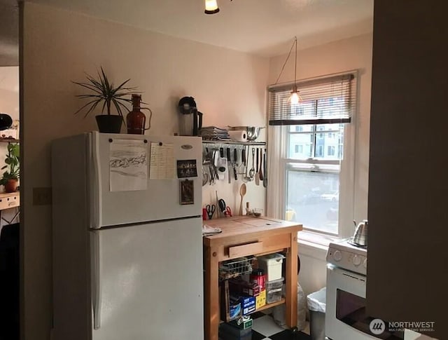 kitchen featuring freestanding refrigerator