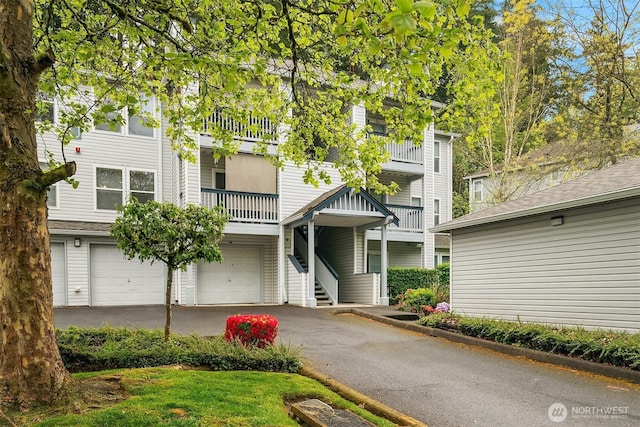 33020 10th Ave SW Unit U203, Federal Way, WA 98023 - view of front facade with a garage, driveway, and stairs