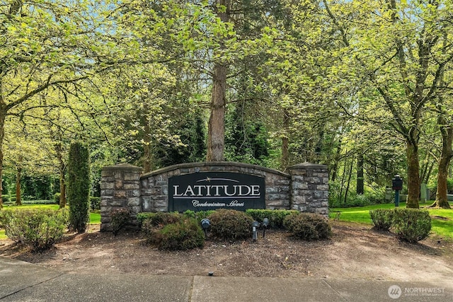 community sign with a view of trees