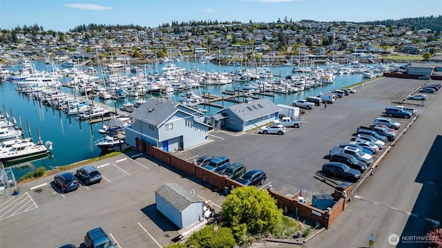 bird's eye view of numerous boat docks and a nearby body of water
