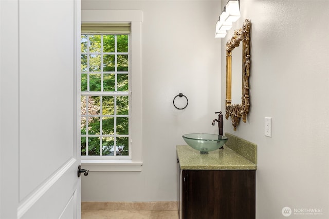 11281 Fieldstone Ln NE, Bainbridge Island, WA 98110 - bathroom featuring vanity, tile patterned floors, and baseboards