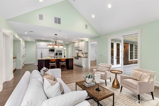 11281 Fieldstone Ln NE, Bainbridge Island, WA 98110 - living area featuring dark wood-type flooring, recessed lighting, baseboards, and high vaulted ceiling