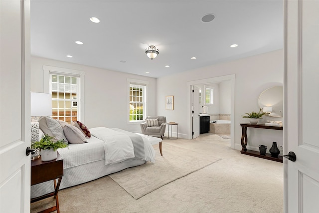 11281 Fieldstone Ln NE, Bainbridge Island, WA 98110 - bedroom featuring light carpet, baseboards, recessed lighting, and connected bathroom