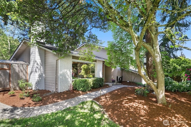 view of front of house featuring brick siding