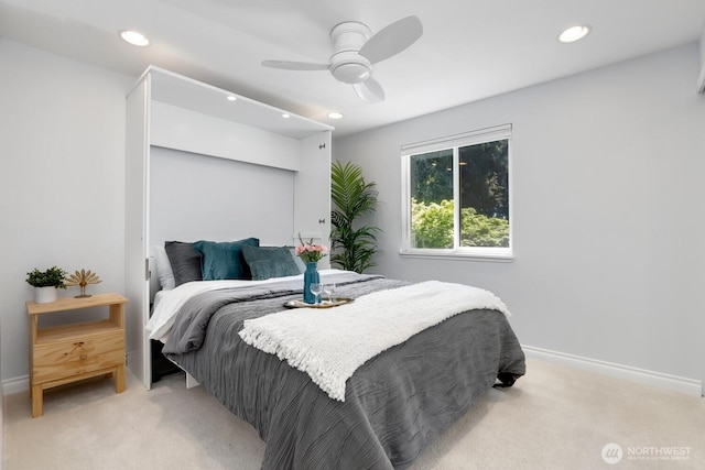 bedroom with light colored carpet, recessed lighting, baseboards, and ceiling fan