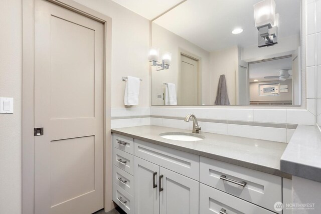 bathroom with vanity and backsplash