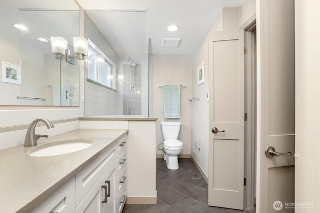 full bathroom featuring a walk in shower, vanity, toilet, tile patterned flooring, and baseboards
