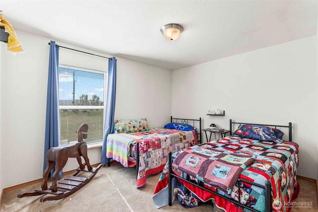 carpeted bedroom with baseboards