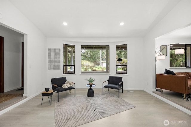sitting room with light wood-type flooring, recessed lighting, and baseboards