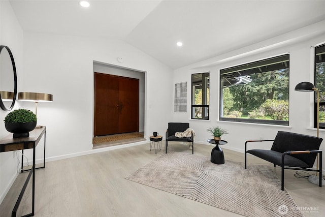 sitting room featuring wood finished floors, recessed lighting, baseboards, and lofted ceiling