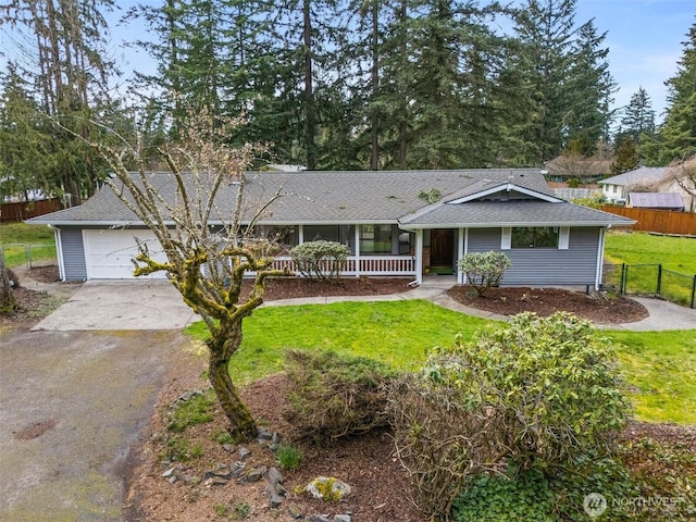 single story home with covered porch, a front yard, fence, concrete driveway, and an attached garage