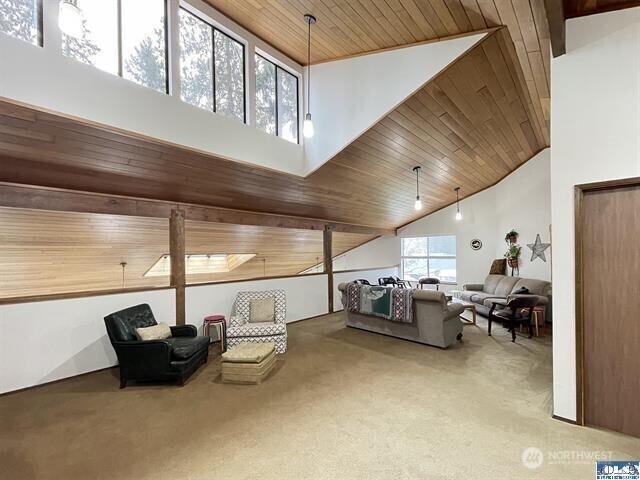 240 Parkwood Blvd, Sequim, WA 98382 - carpeted living area featuring high vaulted ceiling and wood ceiling