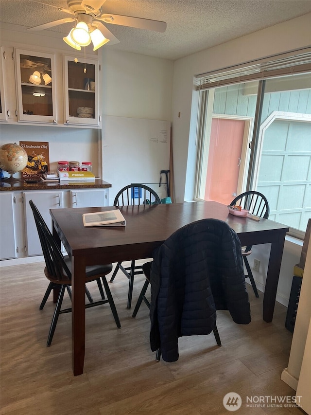 240 Parkwood Blvd, Sequim, WA 98382 - dining room featuring light wood-style floors, a ceiling fan, and a textured ceiling