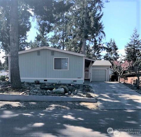 240 Parkwood Blvd, Sequim, WA 98382 - view of front facade with crawl space, a garage, and driveway