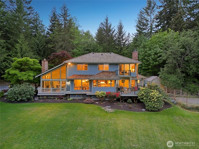 14320 2nd Ave NE, Marysville, WA 98271 - back of property with a chimney, a balcony, and a yard