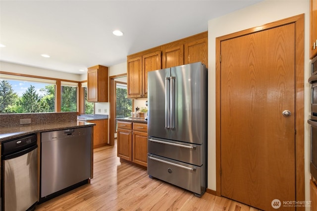 14320 2nd Ave NE, Marysville, WA 98271 - kitchen with appliances with stainless steel finishes, brown cabinetry, light wood-style flooring, and recessed lighting